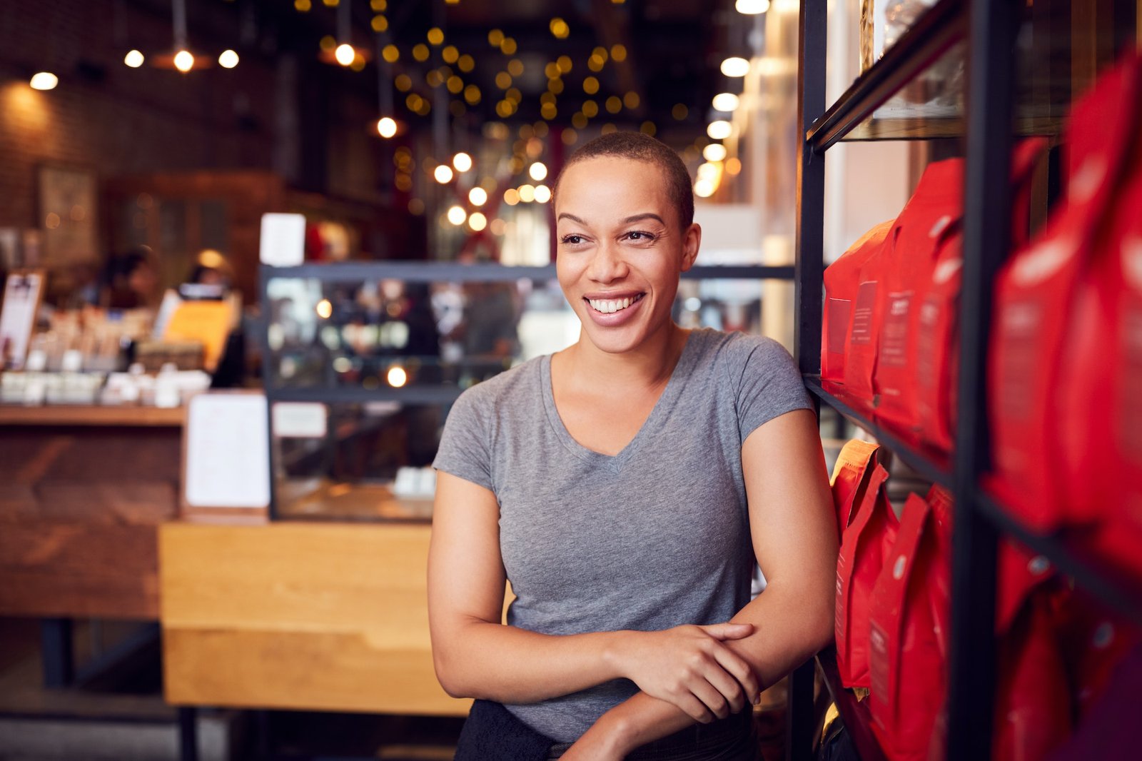 Portrait Of Female Coffee Shop Owner Standing By Counter